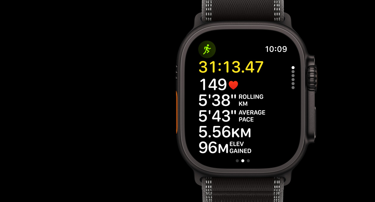 Apple Watch Ultra 3, black colour, titanium case, Workout app, Outdoor Run, left side exterior, Action button, right side exterior, Digital Crown, side button, strap, Trail Loop, black/charcoal colour
